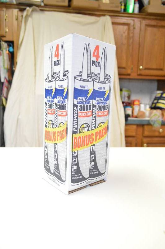 lot 1045 image: 4 pack white lightning quick dry caulk