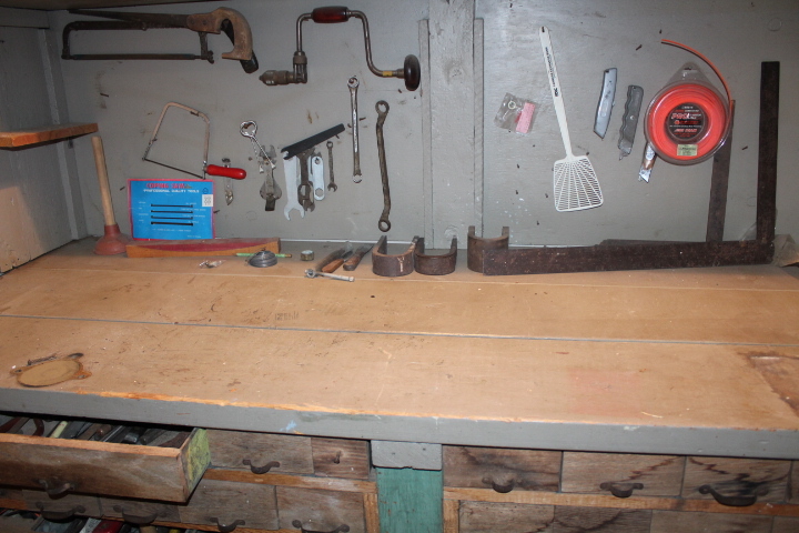 lot 1399 image: All Tools Hanging and on Bench includes Brace, Saws, and Wrenches