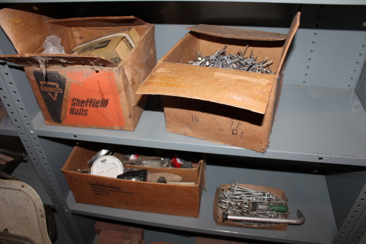lot 1438 image: Contents of 2 Shelves - Pegboard Hooks and Nails
