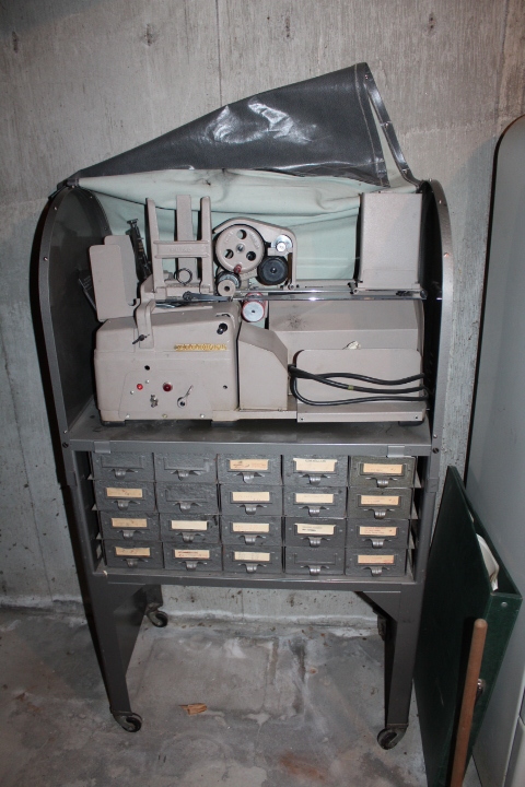 lot 1740 image: Elliott Addressing Machine with Cart -  In Basement