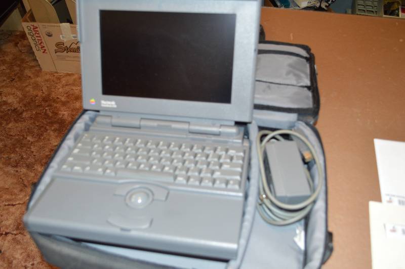 lot 1702 image: MacIntosh laptop in case