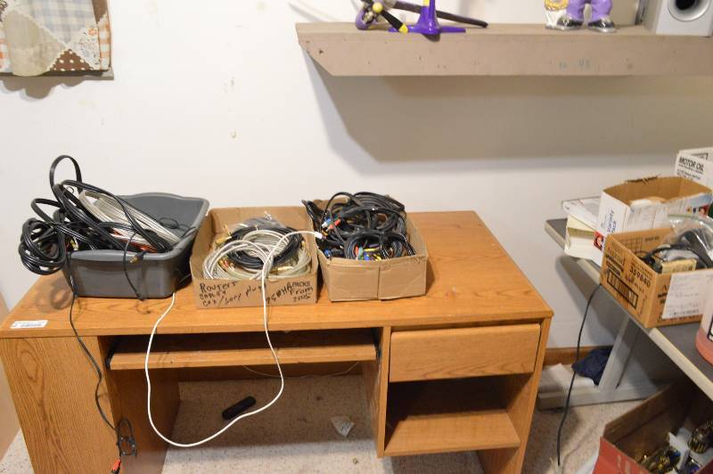 lot 1175 image: All contents pictured - 3 desks, 2 drawer file cabinet, wirescables and trophies