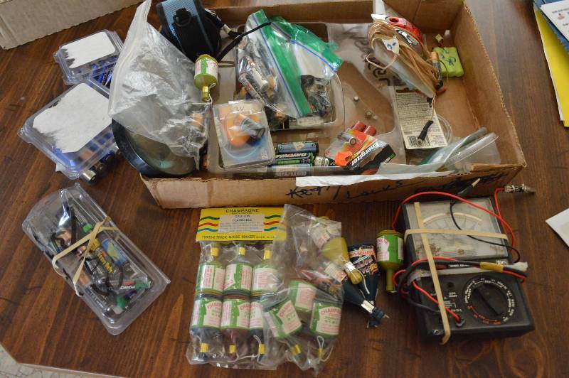lot 1217 image: Box with batteries and party poppers