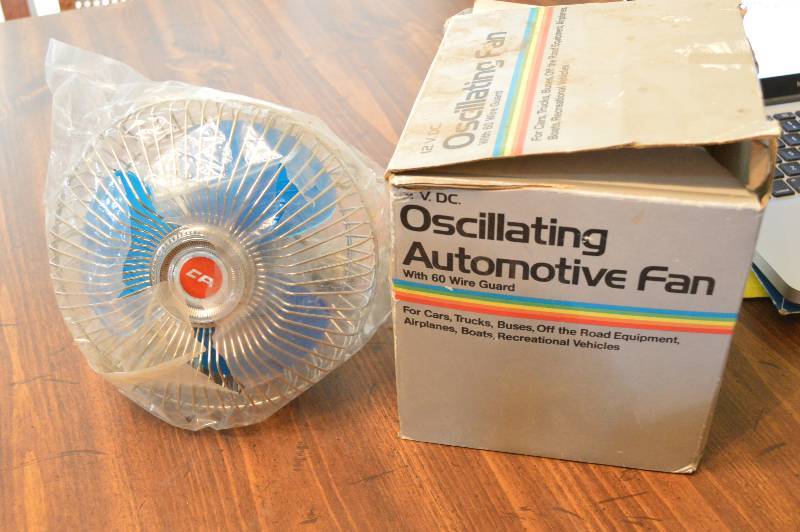 lot 1245 image: 12v Oscillating automotive fan - box is torn