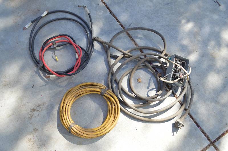 lot 1298 image: Battery cables, RV cord, and yellow cord is missing ends
