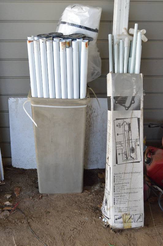 lot 1982 image: Poles and tarp - Pop up shelter