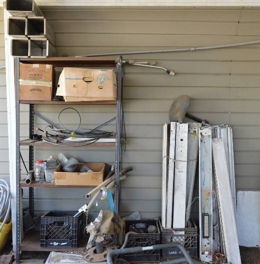 lot 1983 image: Shelf with contents and fluorescent light fixtures