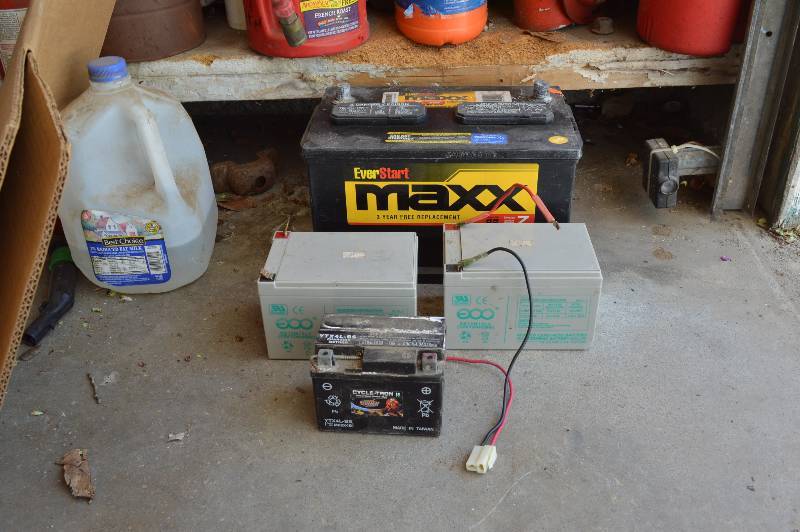 lot 2538 image: Car battery and 3 smaller batteries
