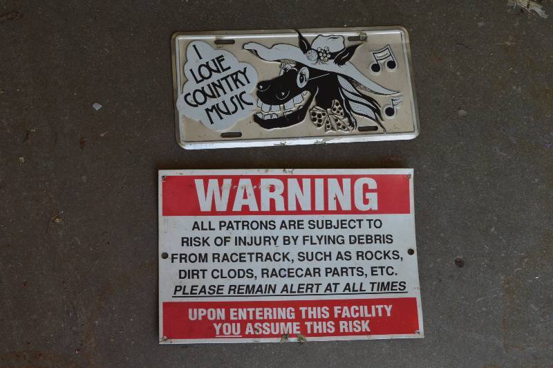 lot 2542 image: Car tag and Warning sign