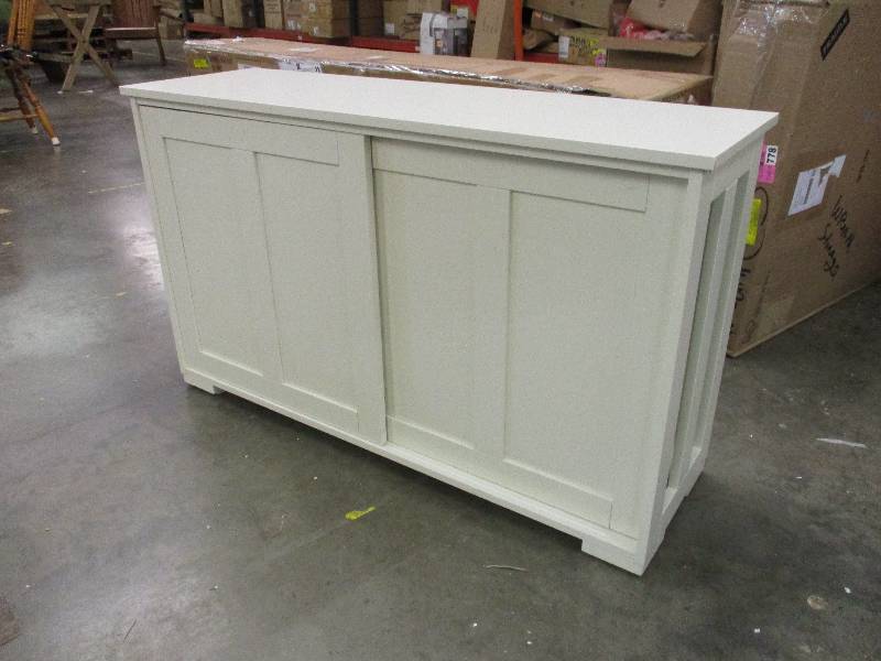 lot 28 image: White TV stand with sliding doors