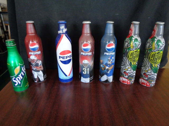 lot 6108 image: 7 Aluminum Collector Bottles