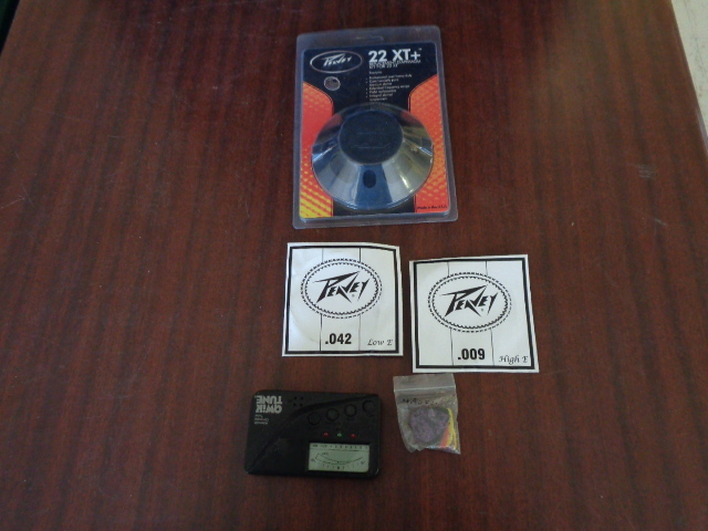 lot 6130 image: 22XT Replacement Diaphragm, Guitar Picks, Automatic Chromatic Tuner and .042 Guitar strings