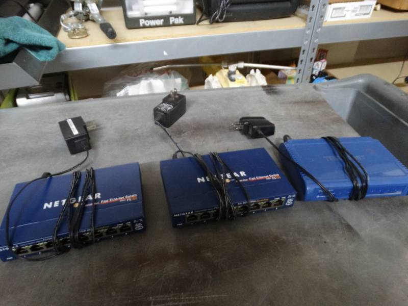 lot 8399 image: 2 netgear 8 port fast ethernet switch and trendnet fast ethernet switch.