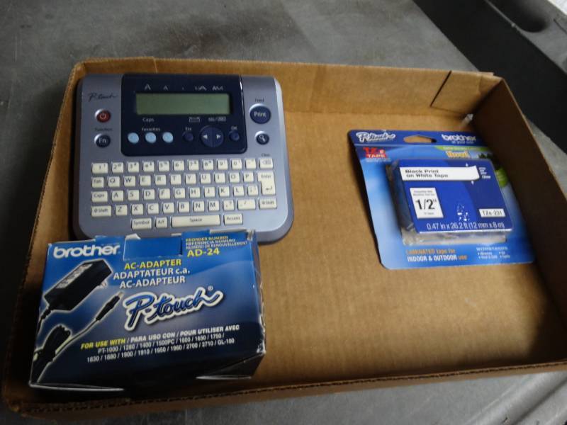lot 8427 image: Brother label maker with power cord, and labels.