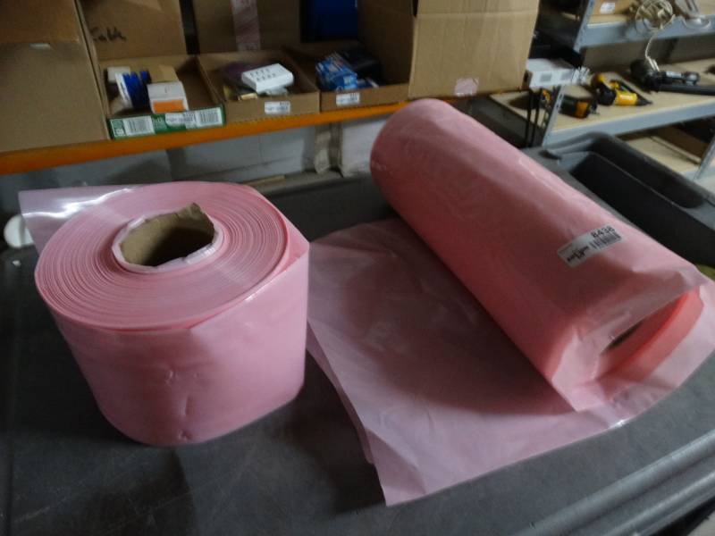 lot 8438 image: Lot of 2 rolls of pink anti-static plastic.