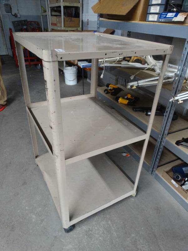 lot 8500 image: Metal media cart on wheels.