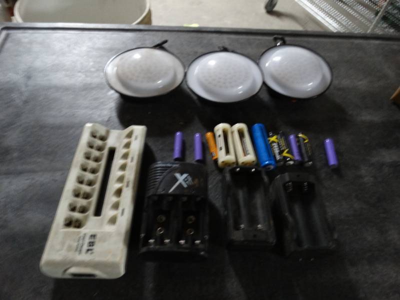 lot 8551 image: Hanging lights and battery rechargers.