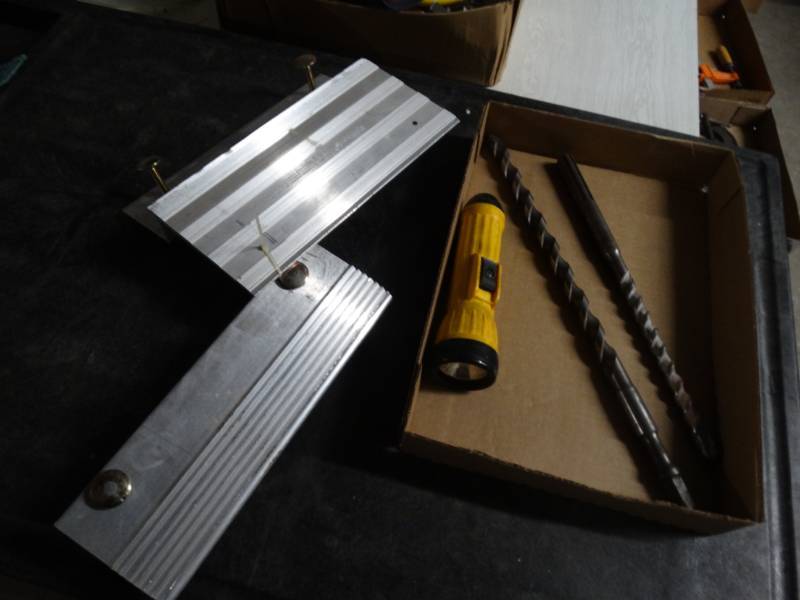 lot 8564 image: Ramp parts, 2 large drill bits and a flashlight.