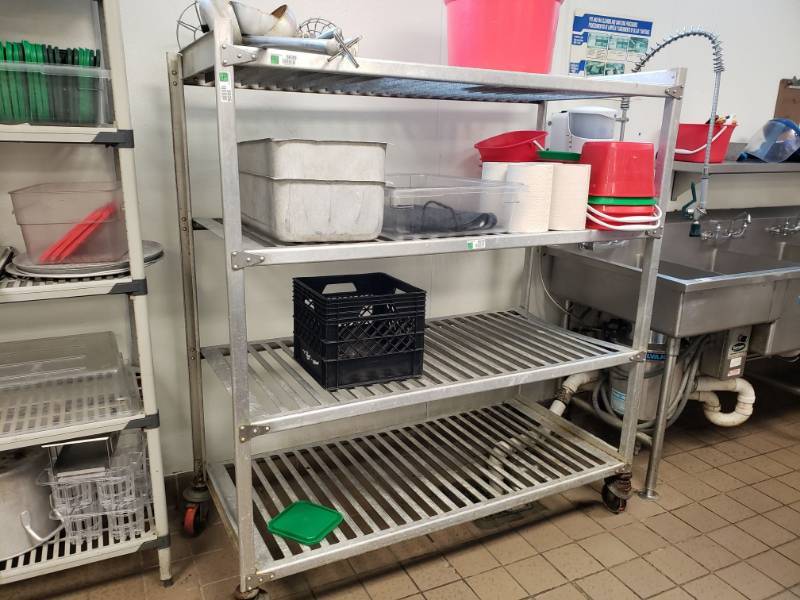 lot 5035 image: 4 Tier Metal Rack on wheels.