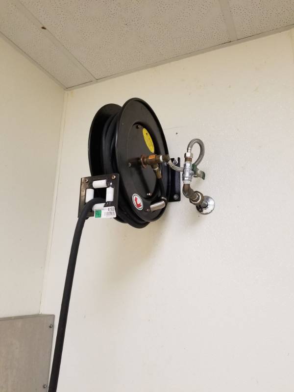 lot 4103 image: Wall Mounted Water Hose With Reel