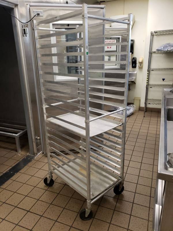 lot 5097 image: Win-Holt Stainless Steel Pan Rack on wheels.