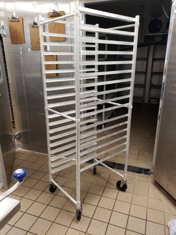 lot 5102 image: Win-Holt Stainless Steel Pan Rack on wheels.