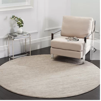 lot 56 image: Harloe IvoryCream Area Rug  Round 67