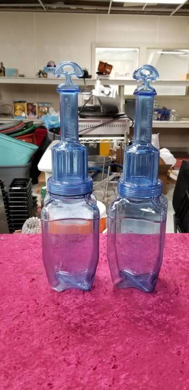 lot 4240 image: Two Rapi-Kool Bottles