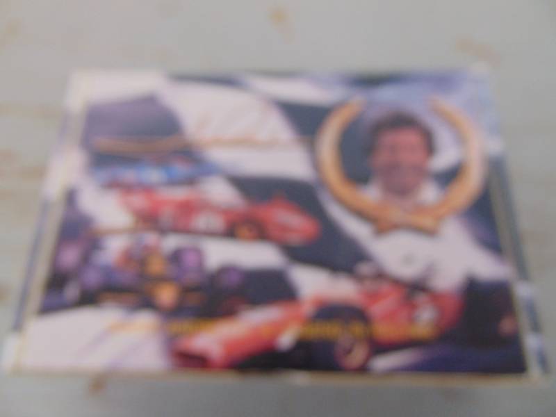 lot 1495 image: Mario Andretti Collector Tin and Memorabilia
