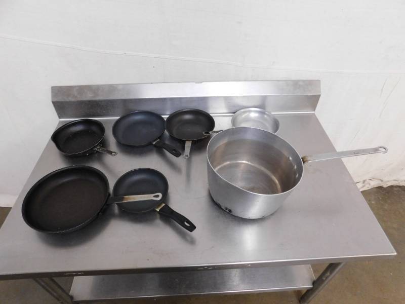 lot 1768 image: Large Pot and 6 Skillets