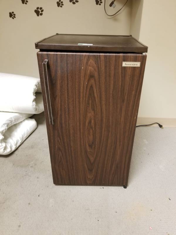 refrigerator in corner of kitchen