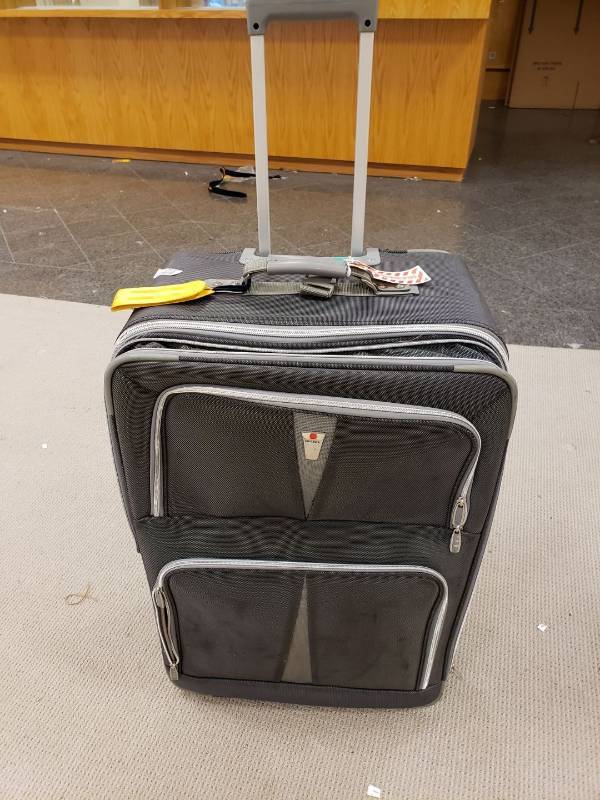 lot 3145 image: Large rolling suitcase