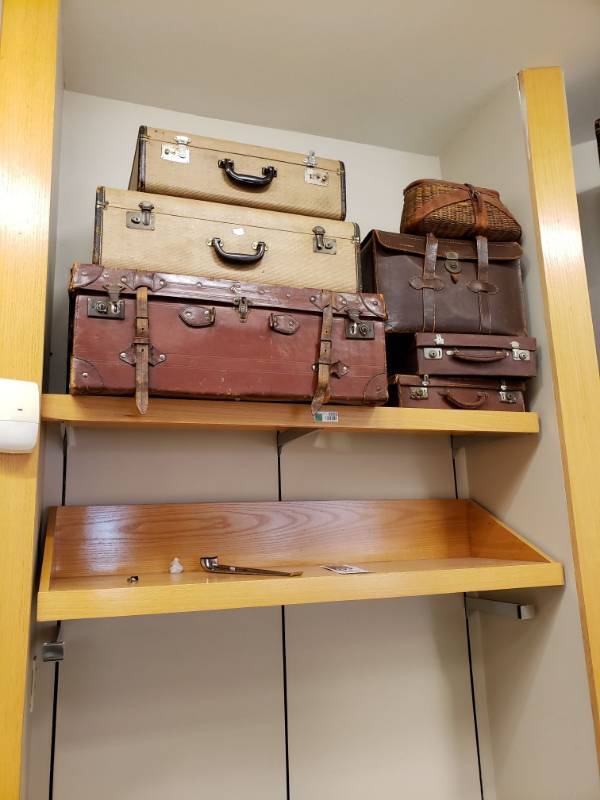 lot 3255 image: (2) Wood Shelves with (7) pieces of Antique Suitcases.