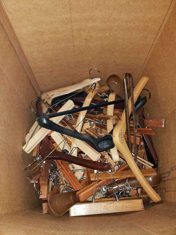lot 9018 image: Box of wooden pant and clothes hangers