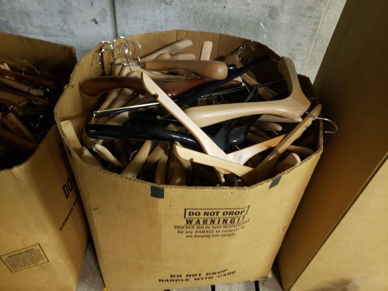 lot 9038 image: Box of wooden clothes hangers