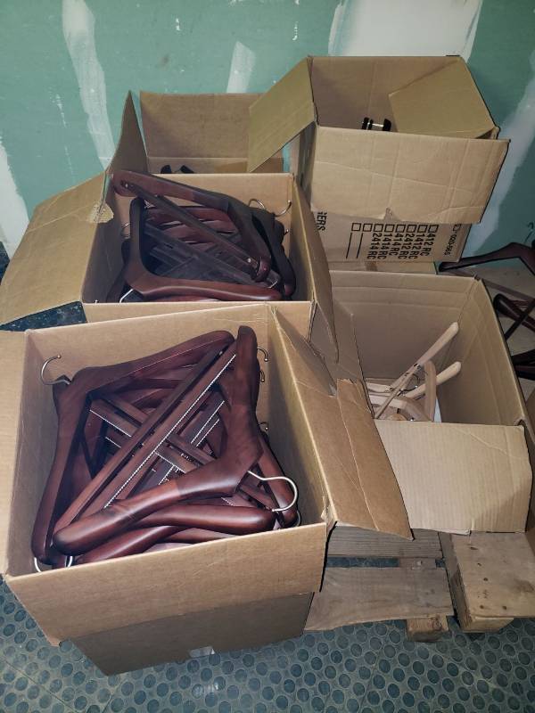 lot 9066 image: (5) boxes of wooden hangers