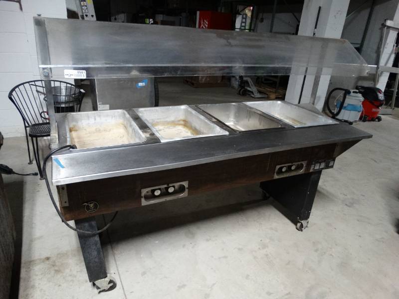 lot 8981 image: Eagle electric 4 hole steam table w sneeze guard- on wheels