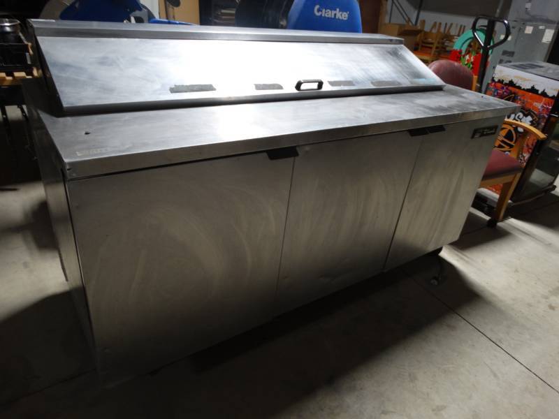 lot 8984 image: True Model-TSSU-72-18 stainless steel commercial prep table cooler on wheels- Works-