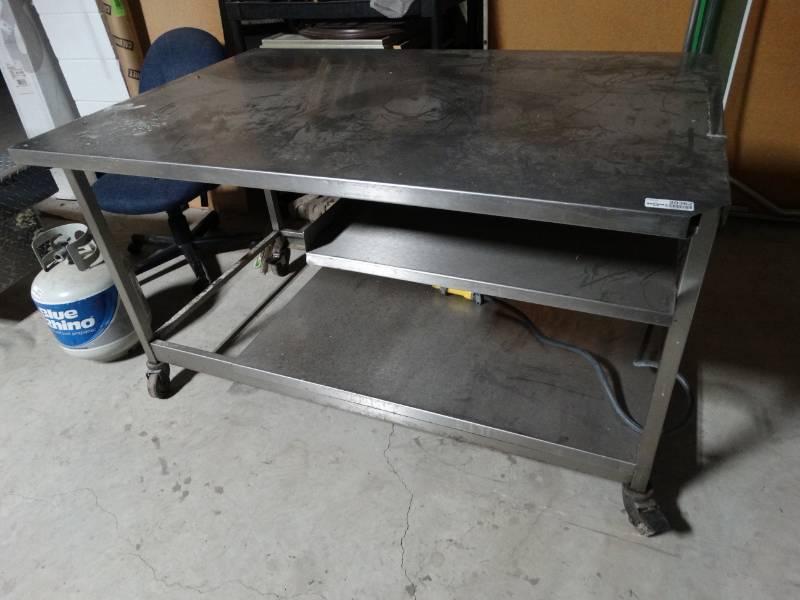 lot 20362 image: Large HD stainless steel table w under shelf- 57 long x 38 wide- on wheels