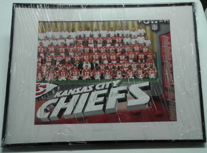 lot 1068 image: Framed Kansas City Chiefs Team Photo & Signed Andre Rison Spiderman Inscription Poster 16x20 inch Piece