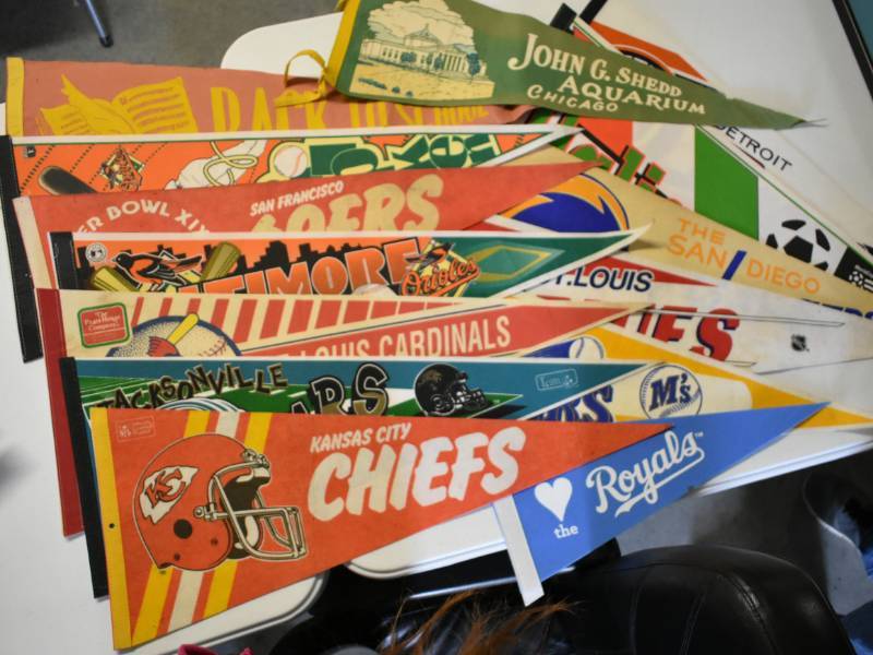 lot 1141 image: Massive Lot of Over a Dozen Vintage Felt Pennants Including Royals, Chiefs, NFL, MLB, Soccer, Cal Ripken, and More