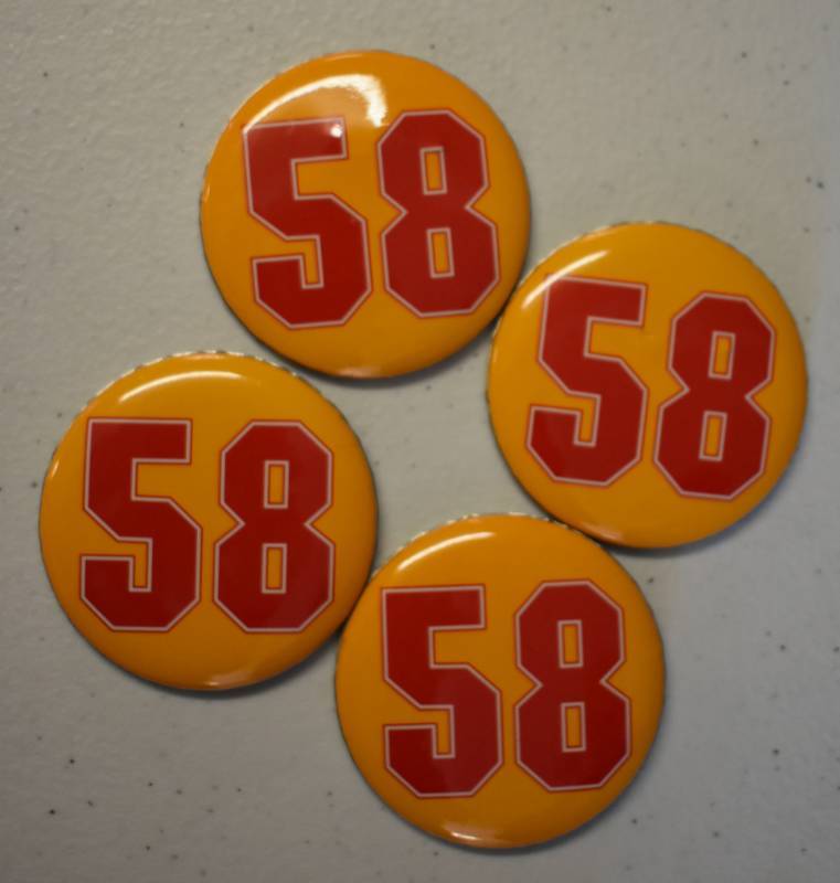 lot 1100 image: Collection of Four Derrick Thomas Kansas City Chiefs #58 Buttons