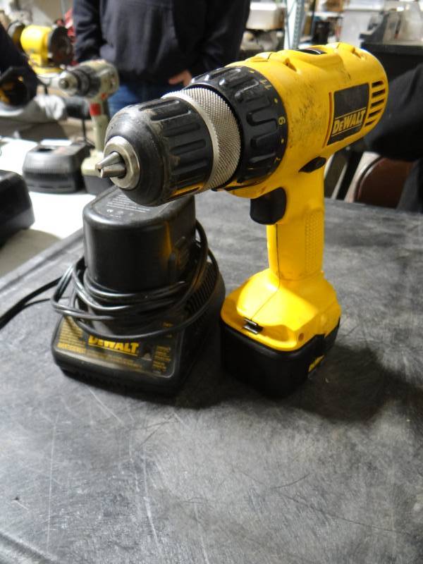 lot 5657 image: DeWalt drill with battery charger.
