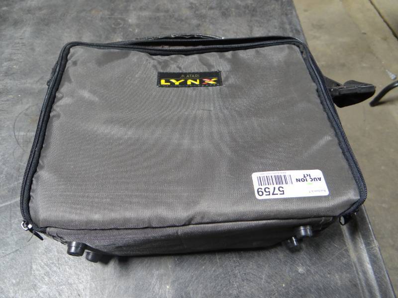 lot 5759 image: Attari lynx hand held game system with games.