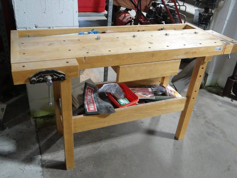 lot 5771 image: Wooden work bench with 2 vises and contents.