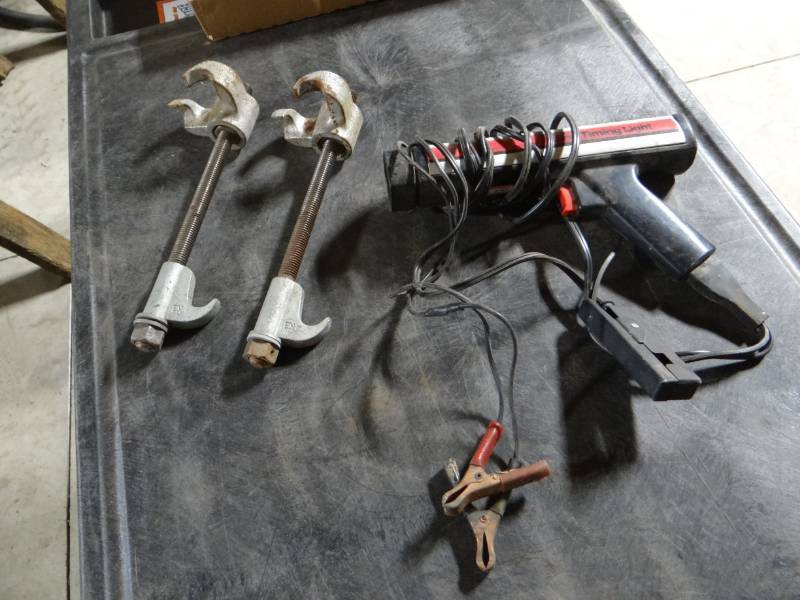 lot 5793 image: Timing light gun and spring compressors.
