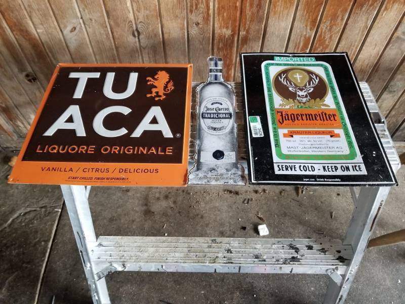lot 3426 image: Tuaca, Jagermeister, and Jose Cuervo Metal Signs