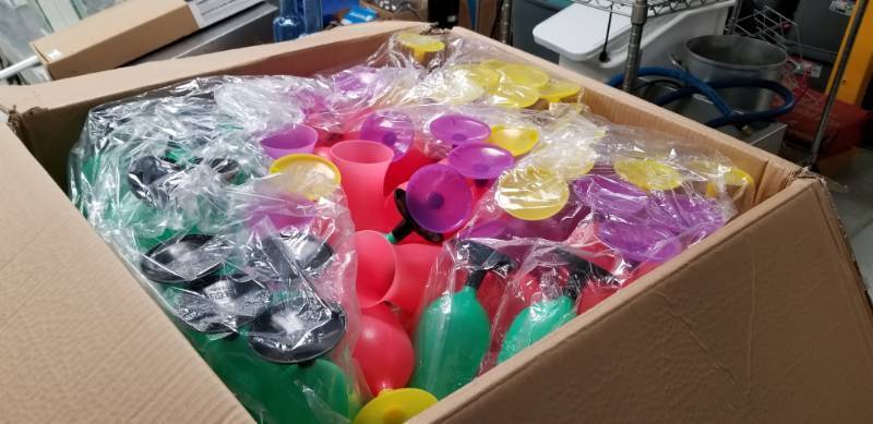 lot 4254 image: Box Full of Multi Color Plastic Cocktail Glasses