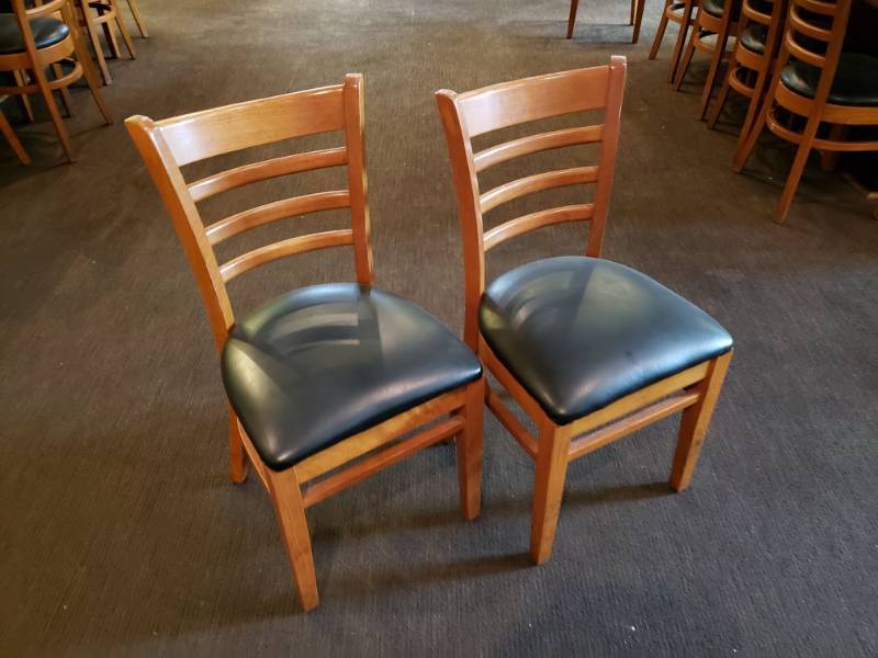 lot 2070 image: (2) Wooden Chairs with Black Padded Seat.