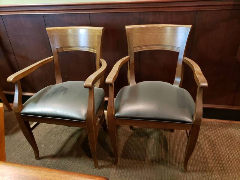 lot 2142 image: (2) Wooden Chairs with Armrest and Black Padded Seat.